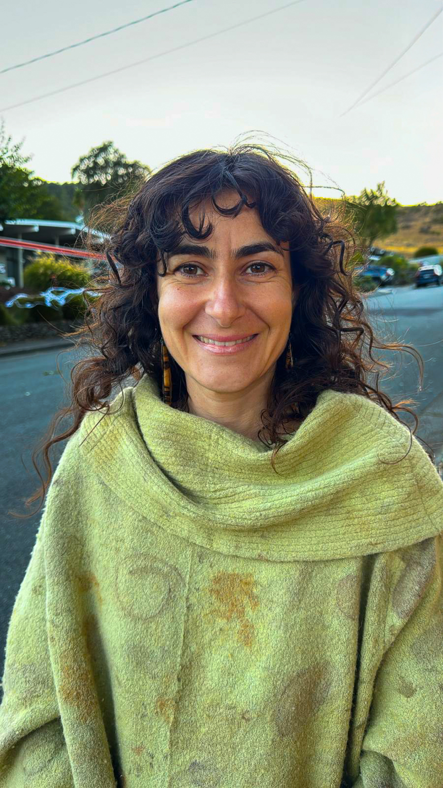 Gabi, founder of HeartWorks Marin, holding a freshly thrown bowl